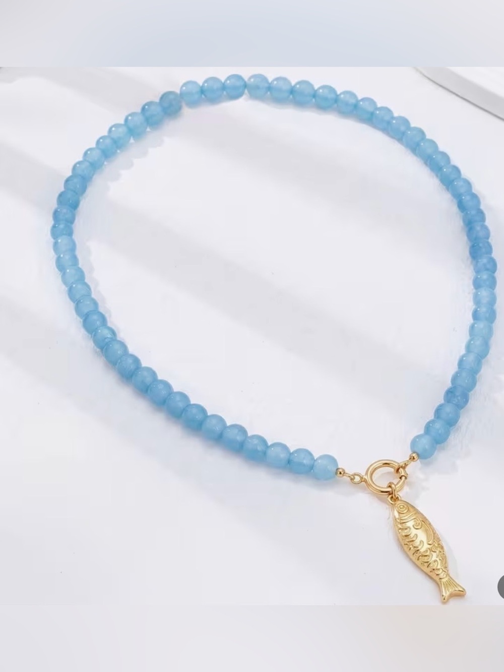 Light Blue Beaded Necklace with Gold Fish Charm 16”